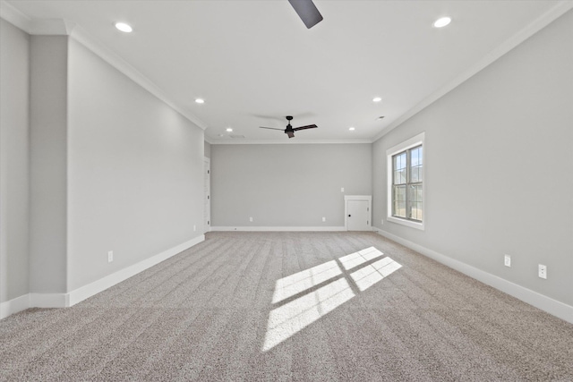 carpeted empty room featuring ornamental molding and ceiling fan