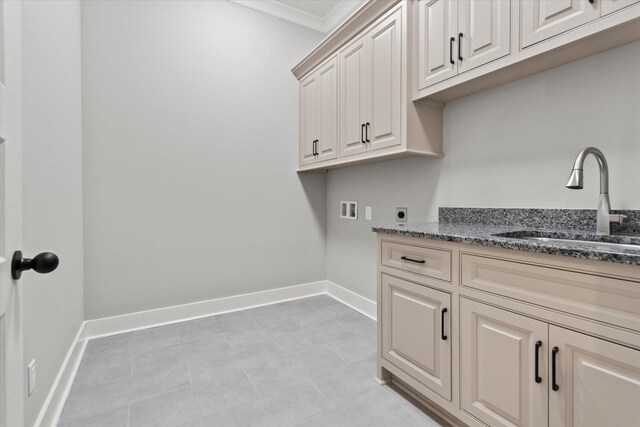 laundry area with sink, cabinets, washer hookup, crown molding, and hookup for an electric dryer