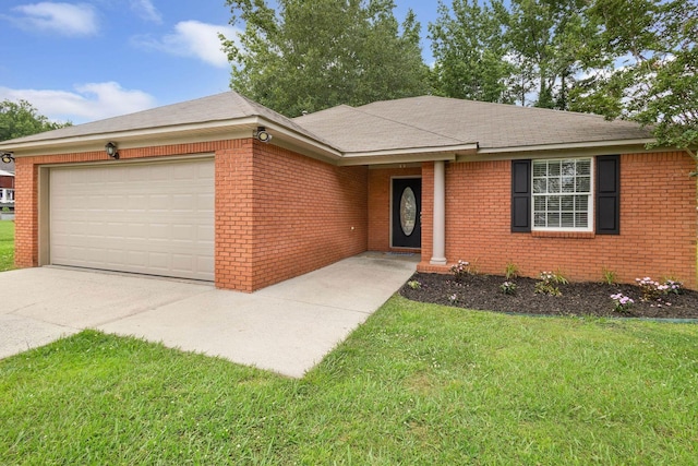  - ranch-style house featuring an attached garage, a front lawn, brick siding, and driveway