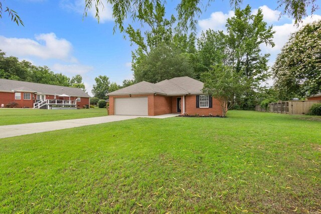  - single story home with a garage, brick siding, and concrete driveway
