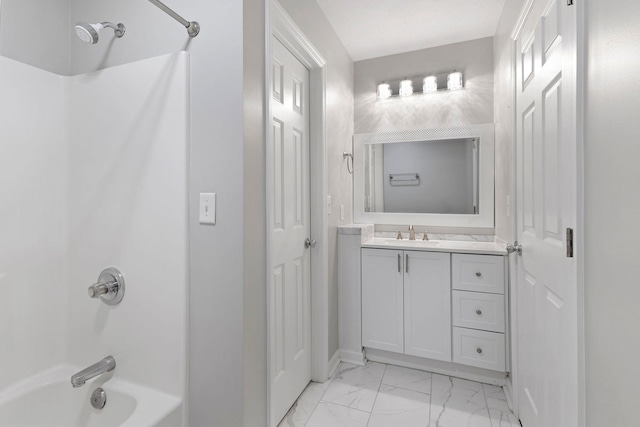  - full bath with  shower combination, marble finish flooring, and vanity