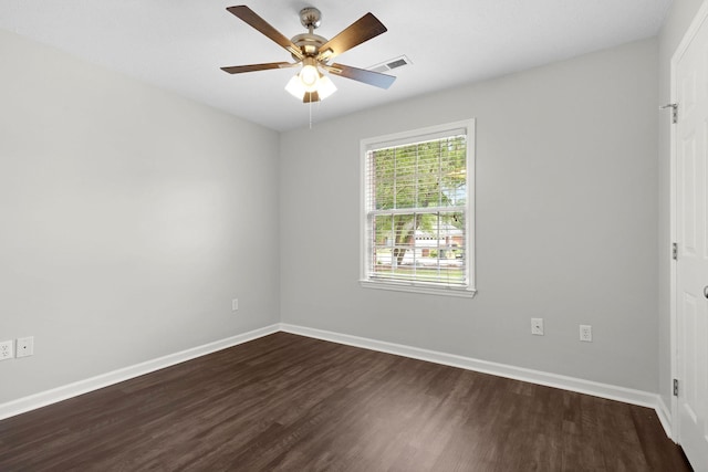  - empty room featuring dark wood-type flooring and ceiling fan