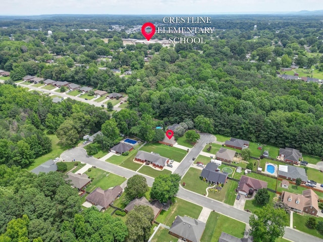  - aerial view of property and surrounding area with nearby suburban area