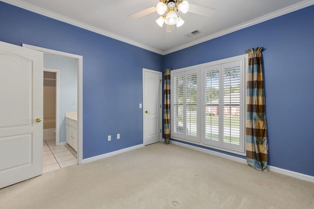 empty room with a ceiling fan, light carpet, crown molding, and visible vents