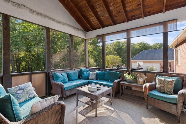 sunroom with lofted ceiling with beams and wood ceiling