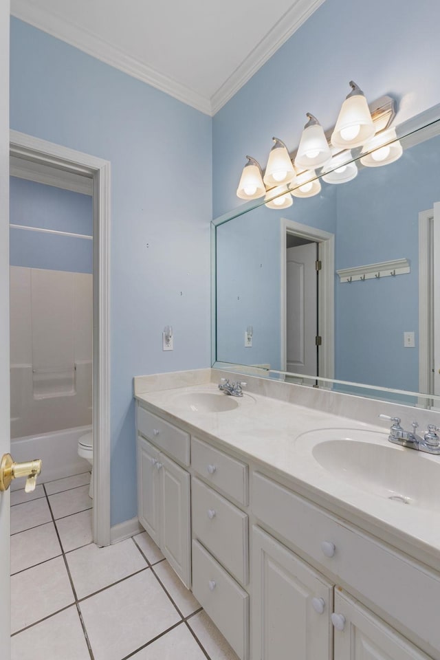 full bath featuring toilet, ornamental molding, a sink, and tile patterned floors