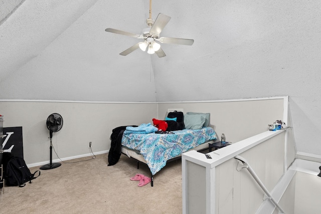 bedroom with baseboards, lofted ceiling, ceiling fan, and carpet flooring