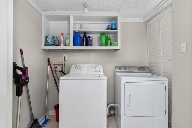 clothes washing area featuring laundry area and washer and clothes dryer