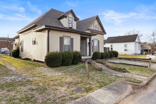 view of front of house featuring a shingled roof