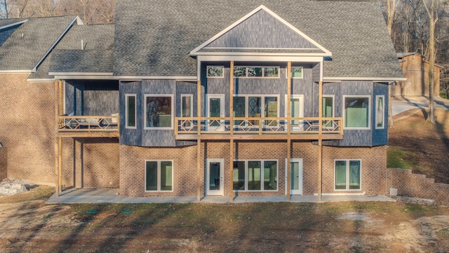 rear view of property featuring a patio