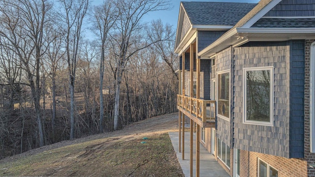 view of property exterior featuring a sunroom