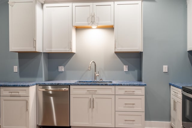 kitchen featuring white cabinetry, stainless steel appliances, and sink