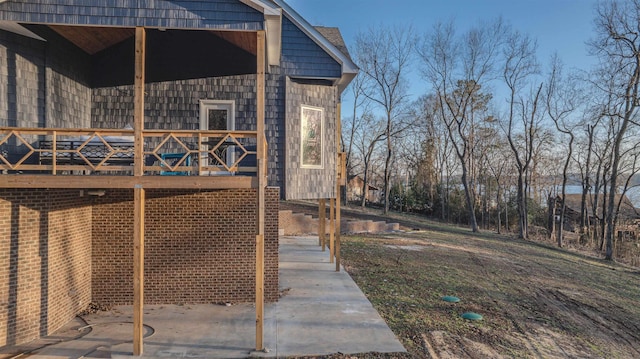 view of side of property featuring a deck