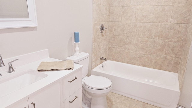 bathroom featuring washtub / shower combination, vanity, tile patterned flooring, and toilet