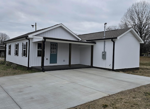 view of front of home featuring covered porch and a shingled roof