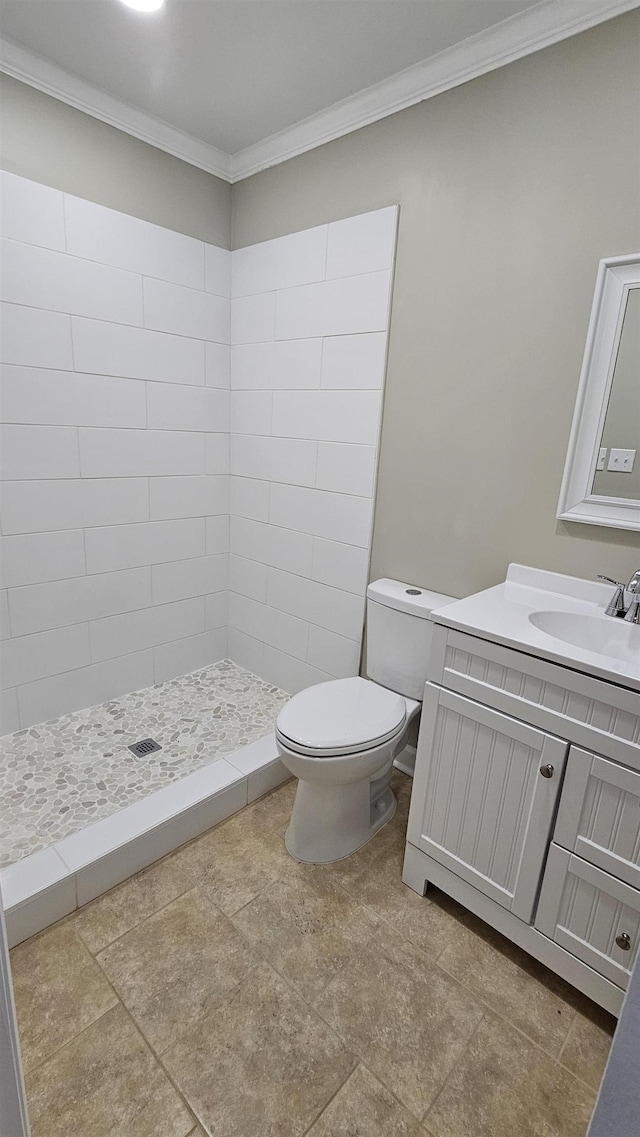 full bathroom featuring toilet, a shower stall, crown molding, and vanity