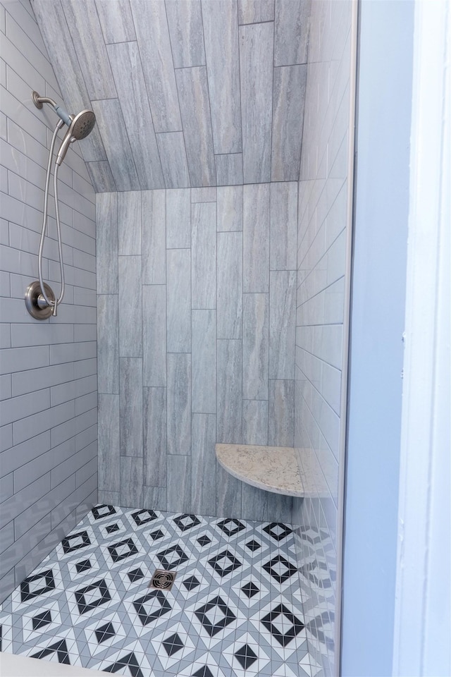 full bathroom with a tile shower