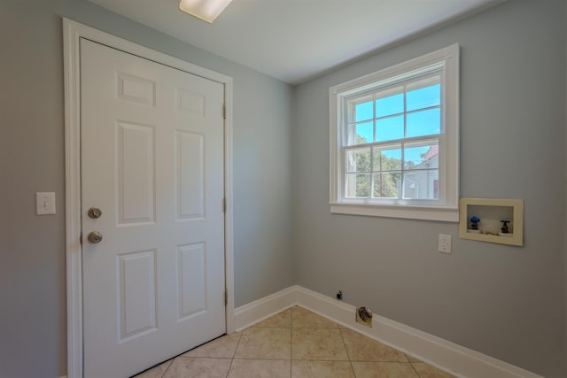 laundry area with washer hookup, baseboards, light tile patterned floors, hookup for a gas dryer, and hookup for an electric dryer
