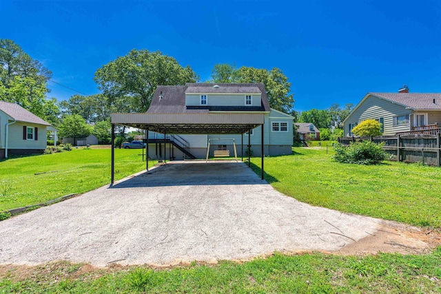 view of front of house with a carport and asphalt driveway