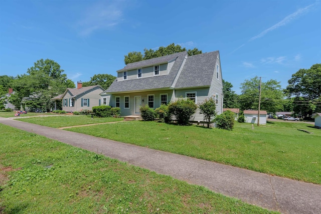 bungalow-style home with a front yard and a shingled roof