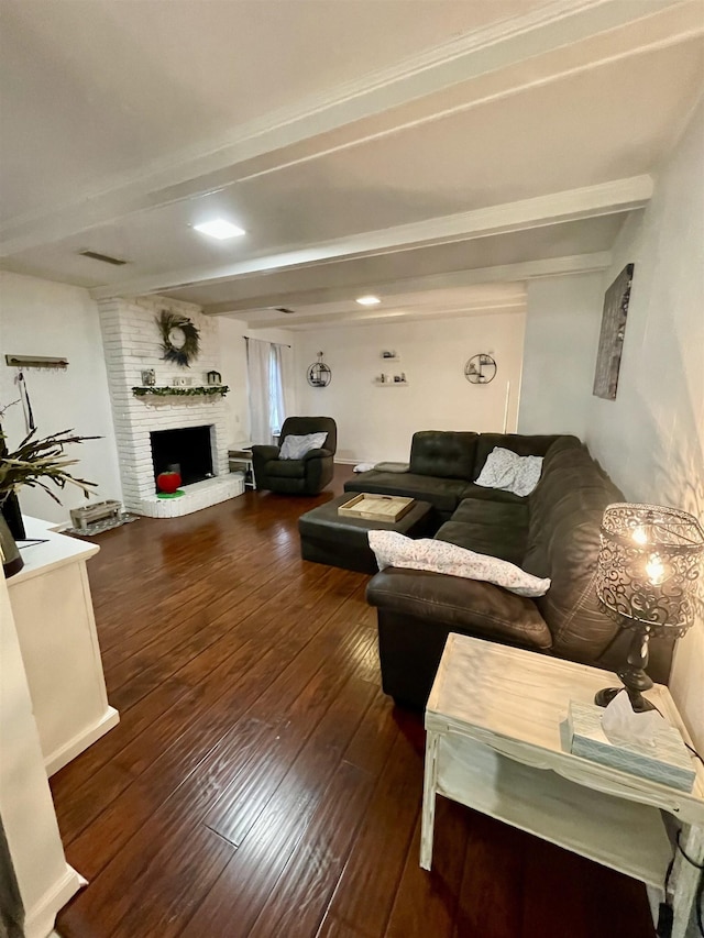  - living room with beam ceiling, wood-type flooring, and a fireplace