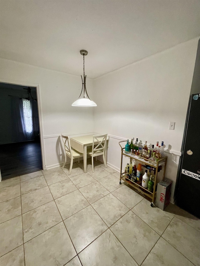  - dining room with light tile patterned floors and baseboards