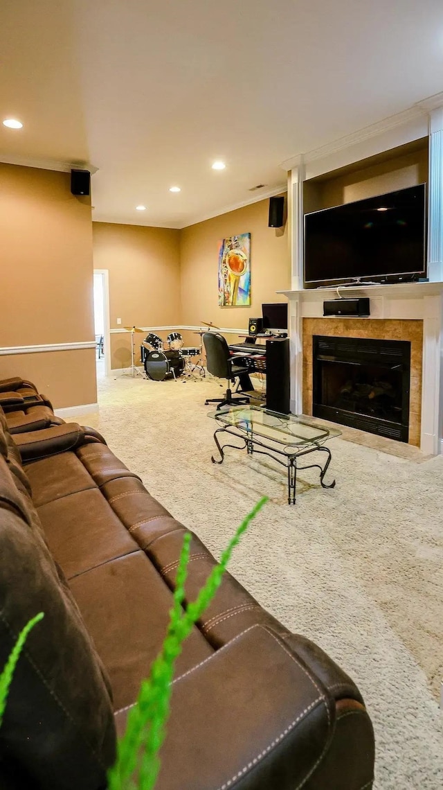 living room featuring recessed lighting, carpet flooring, and a fireplace