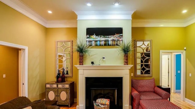 living area with light wood-type flooring, ornamental molding, a fireplace, and recessed lighting