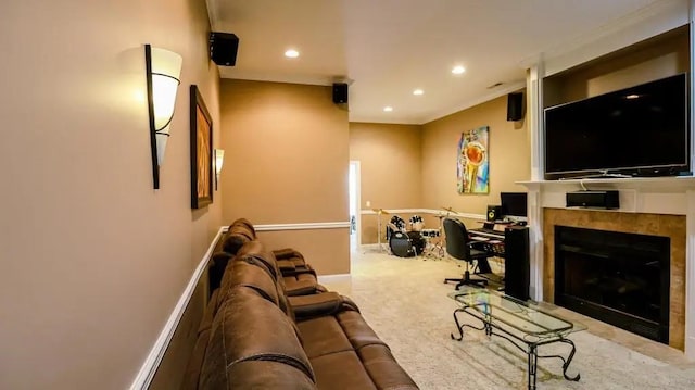 living area featuring baseboards, carpet floors, a tiled fireplace, and recessed lighting