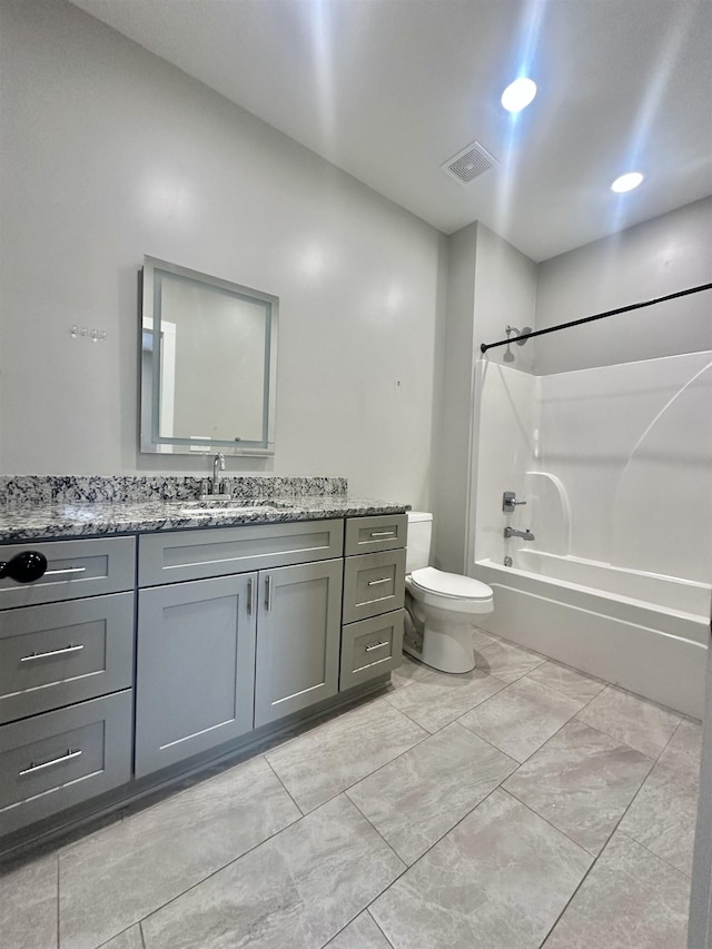 full bathroom featuring  shower combination, visible vents, vanity, and toilet