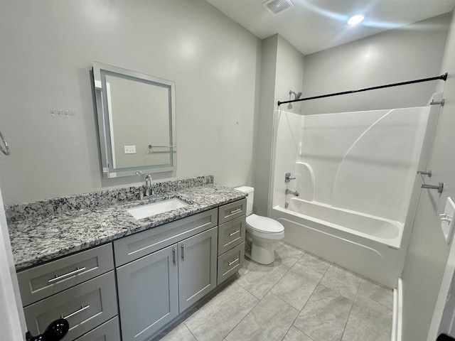 full bathroom featuring visible vents, toilet, vanity, and washtub / shower combination