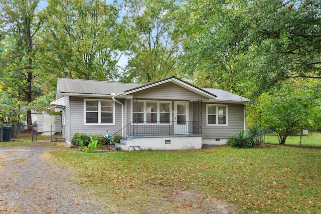 view of front of property with covered porch and a front lawn