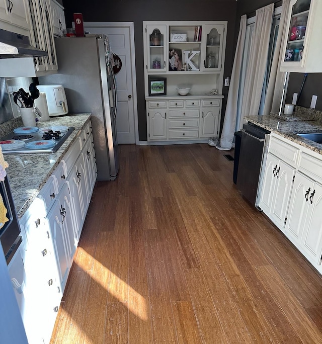 kitchen featuring white cabinetry, dishwasher, light stone countertops, and gas cooktop