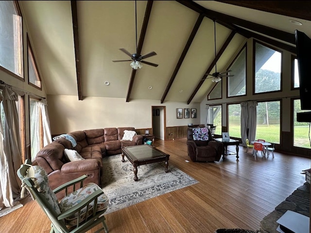 living room featuring beam ceiling, ceiling fan, high vaulted ceiling, and hardwood / wood-style flooring