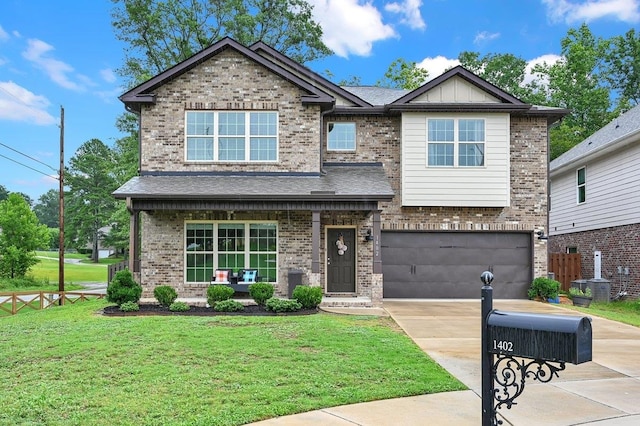 craftsman-style home with a front yard and a garage