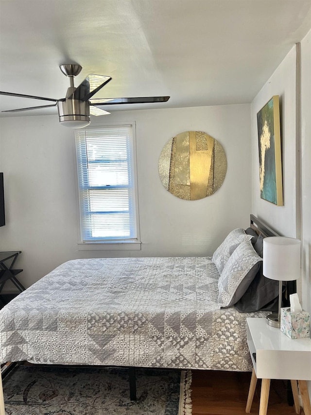 bedroom with hardwood / wood-style floors and ceiling fan