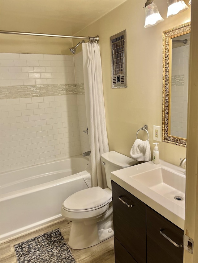 full bathroom with wood-type flooring, vanity, toilet, and shower / bath combo with shower curtain