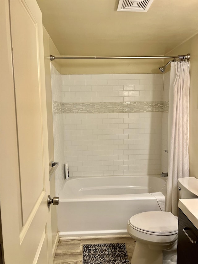 bathroom with vanity, toilet, and wood-type flooring