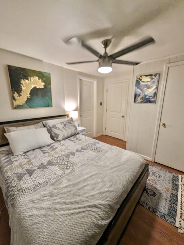 bedroom featuring ceiling fan and hardwood / wood-style flooring