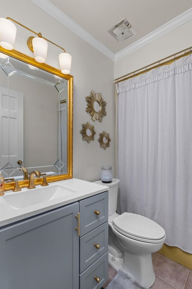 bathroom with tile patterned floors, vanity, toilet, and ornamental molding