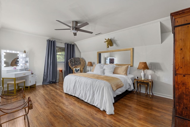 bedroom featuring ceiling fan, dark hardwood / wood-style flooring, vaulted ceiling, and ornamental molding