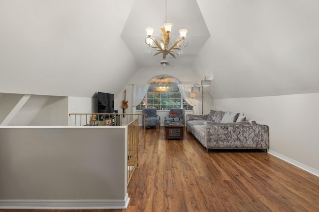 living room featuring hardwood / wood-style floors, vaulted ceiling, and a notable chandelier