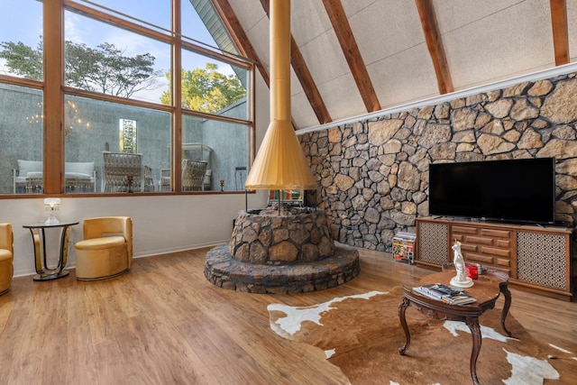 living room featuring beamed ceiling, floor to ceiling windows, wood-type flooring, and high vaulted ceiling