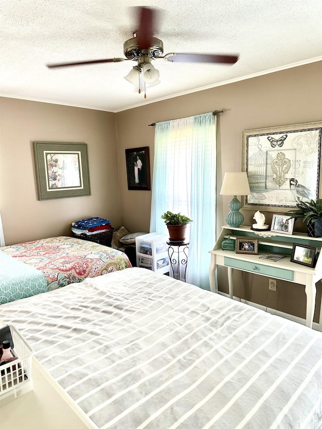  - bedroom featuring crown molding, a textured ceiling, and a ceiling fan