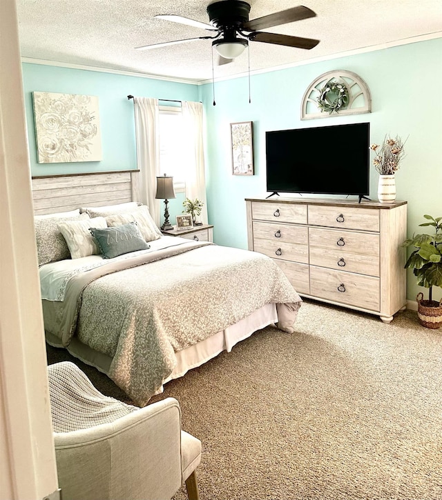  - bedroom with crown molding, carpet flooring, a textured ceiling, and a ceiling fan