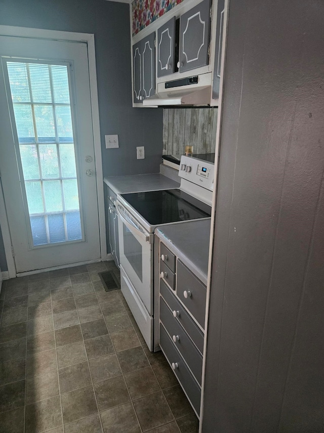 kitchen with stainless steel fridge and electric stove