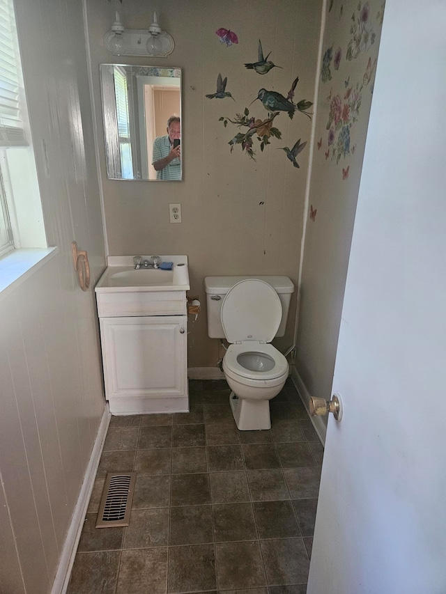 bathroom with vanity and toilet