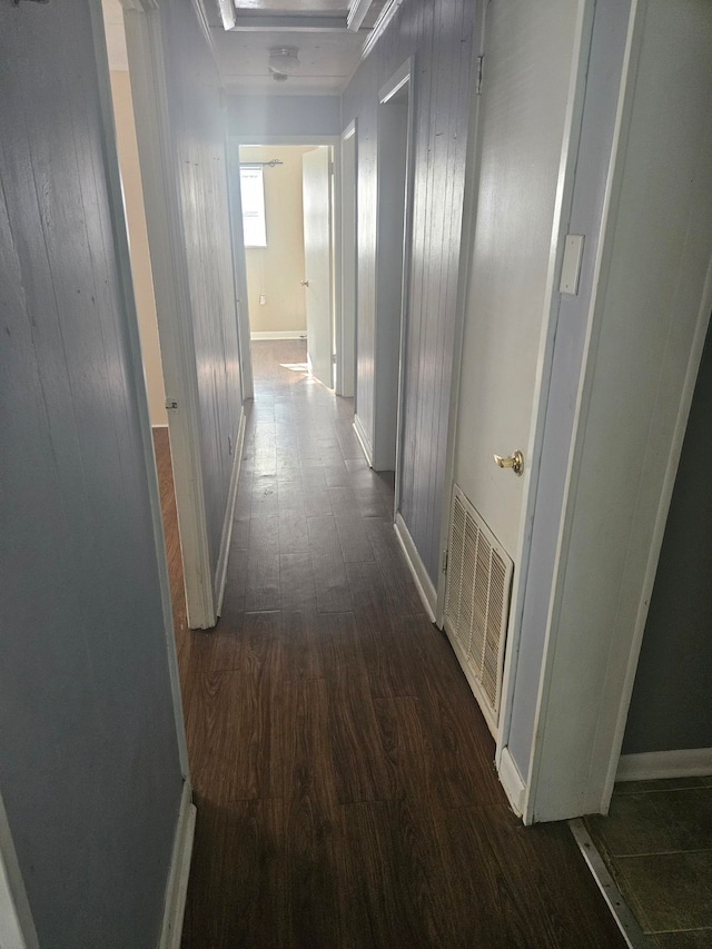 hall featuring dark hardwood / wood-style flooring and ornamental molding