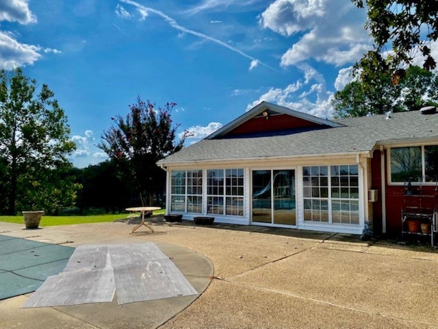 rear view of property featuring a patio area