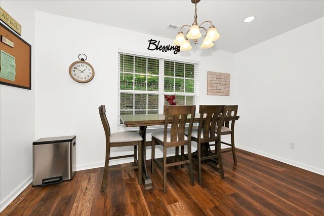  - dining area featuring a chandelier, wood finished floors, baseboards, and recessed lighting